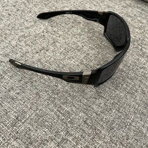 Men’s Oakley brand offshoot sunglasses in black.